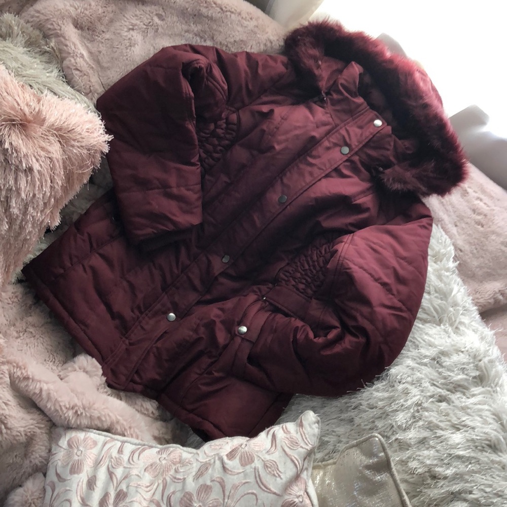 Burgundy winter jacket.